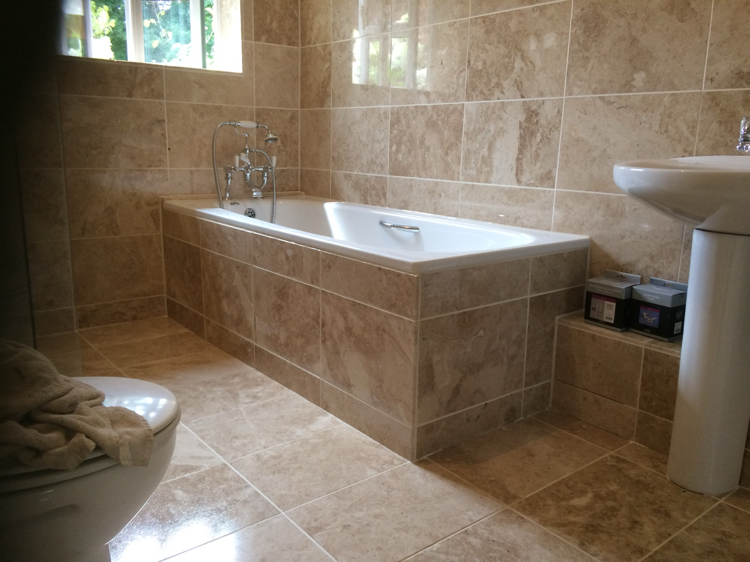 Fully tiled bathroom bath area
