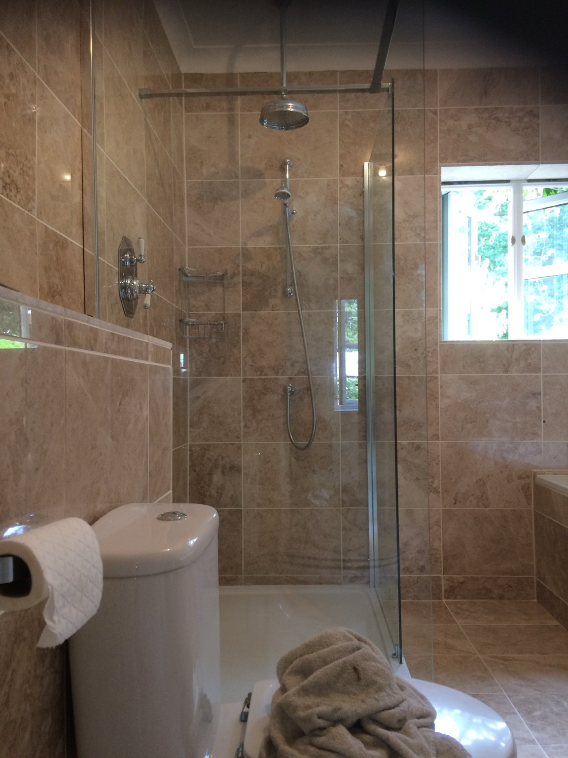 Fully tiled bathroom shower area