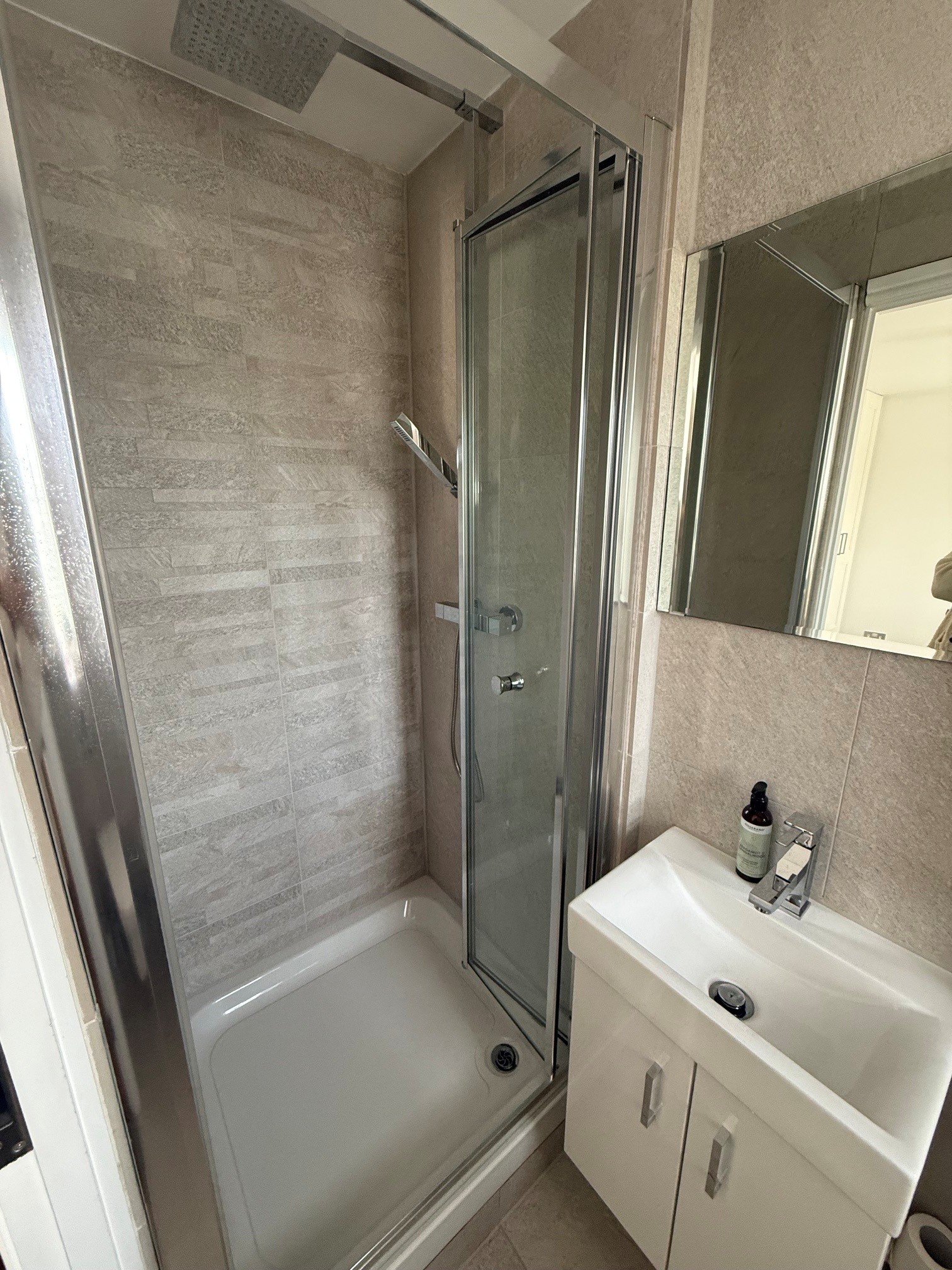 En-suite shower enlarged and modernised